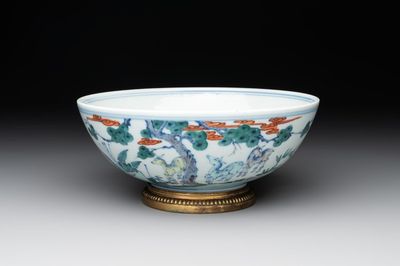 A Chinese doucai 'deer' bowl with gilt bronze stand, Chenghua mark, 18th C.