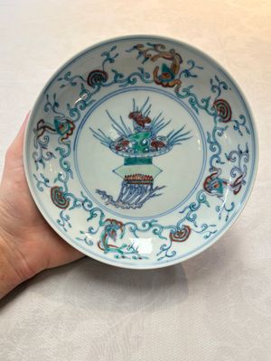 A Chinese doucai 'flower basket' plate, Chenghua mark, 18/19th C. — photo 1
