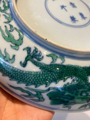 A Chinese doucai green-enamelled 'dragon' dish, Kangxi mark and probably of the period — photo 15