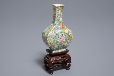 A Chinese eggshell famille rose millefleurs vase on stand, Qianlong mark, 18/19th C.