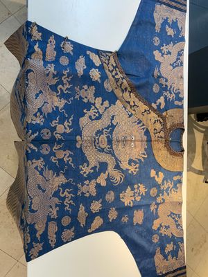 A Chinese embroidered silk blue-ground summer gauze 'nine dragons' robe, 19th C. — photo 1