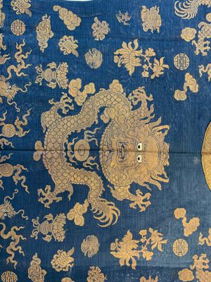 A Chinese embroidered silk blue-ground summer gauze 'nine dragons' robe, 19th C. — photo 12