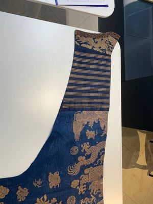 A Chinese embroidered silk blue-ground summer gauze 'nine dragons' robe, 19th C. — photo 15