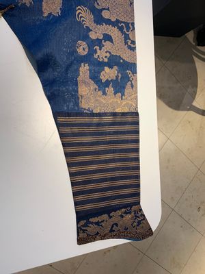 A Chinese embroidered silk blue-ground summer gauze 'nine dragons' robe, 19th C. — photo 17