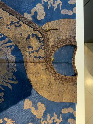 A Chinese embroidered silk blue-ground summer gauze 'nine dragons' robe, 19th C. — photo 3