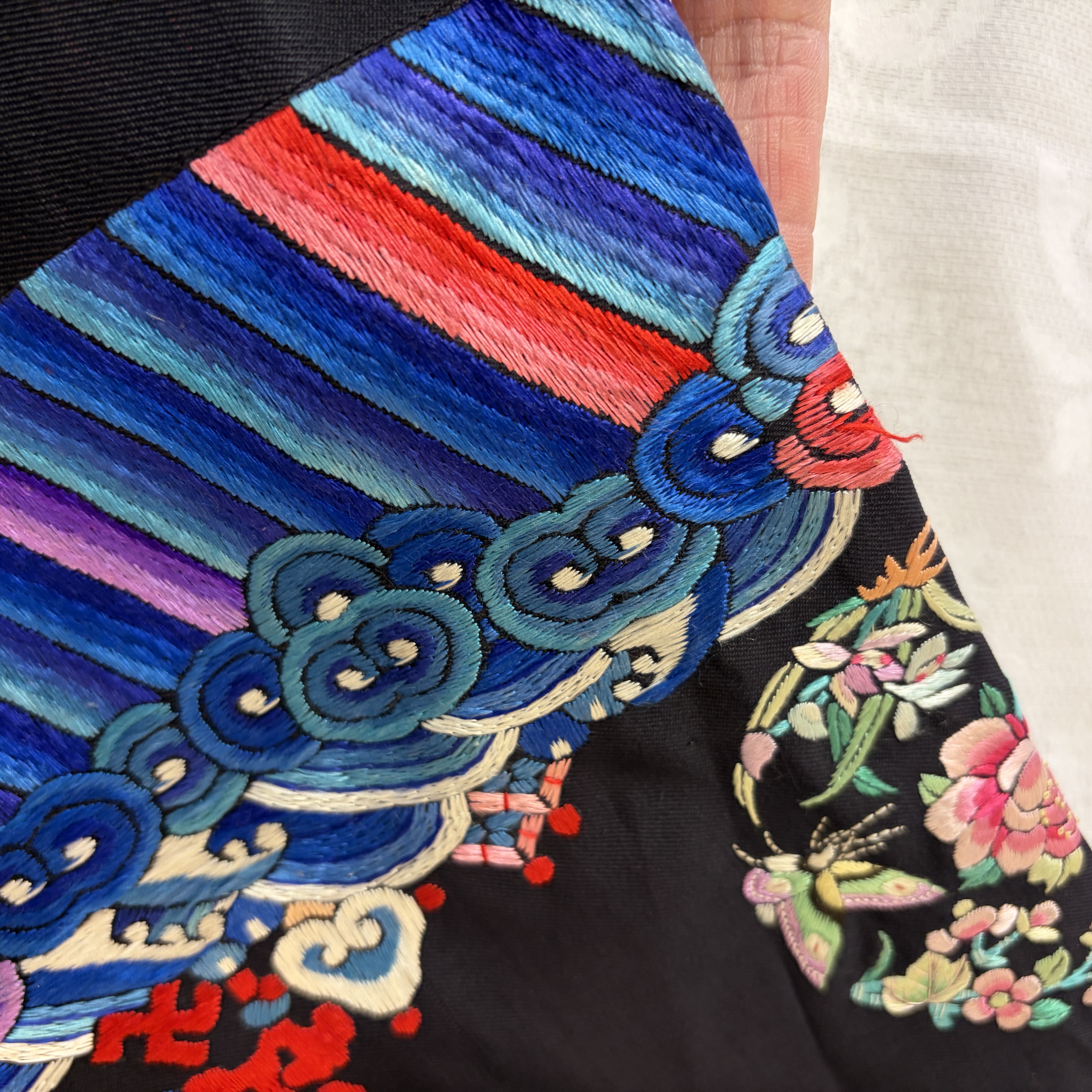 A Chinese embroidered silk dark-blue-ground robe with floral medallions — photo 9