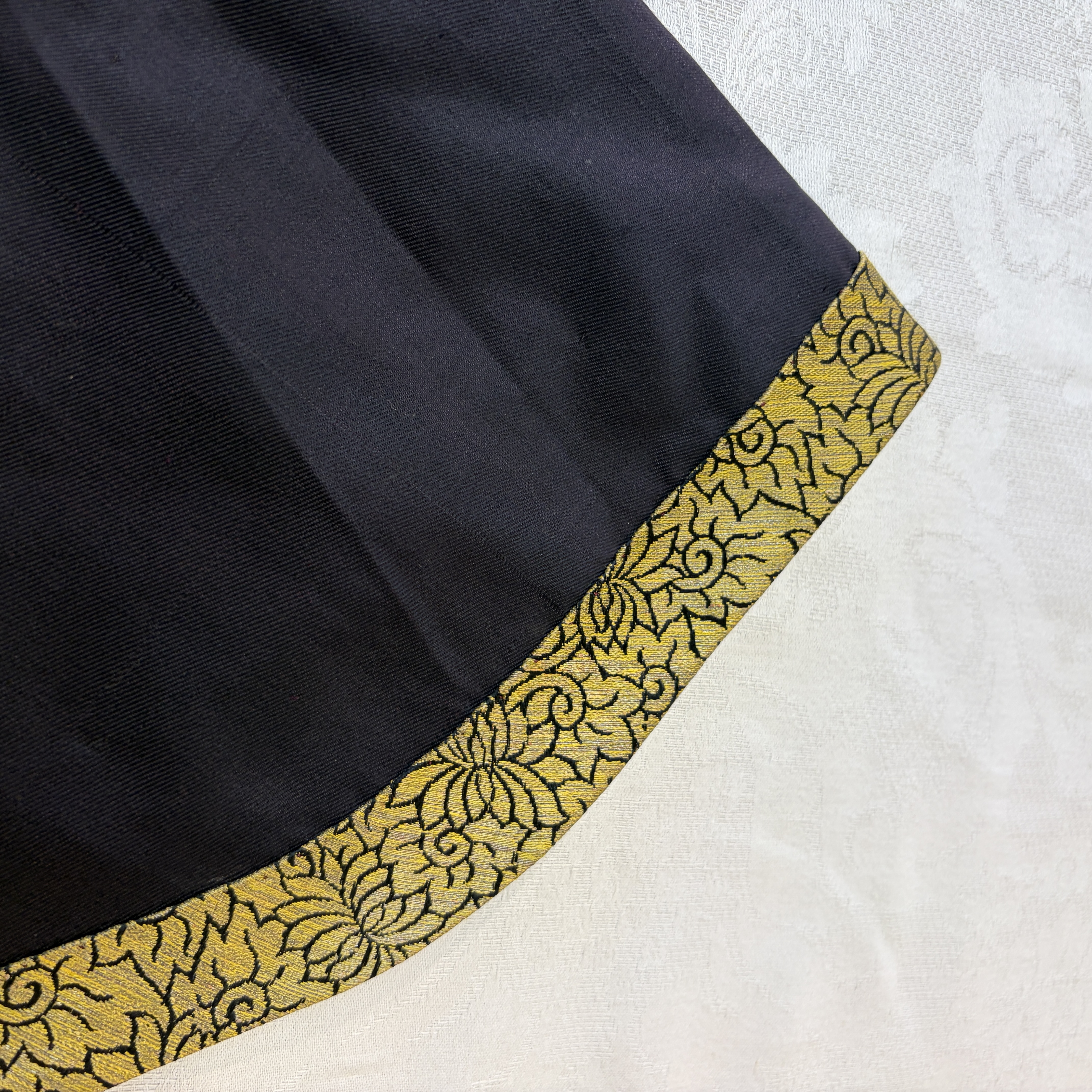 A Chinese embroidered silk dark-blue-ground robe with floral medallions — photo 12