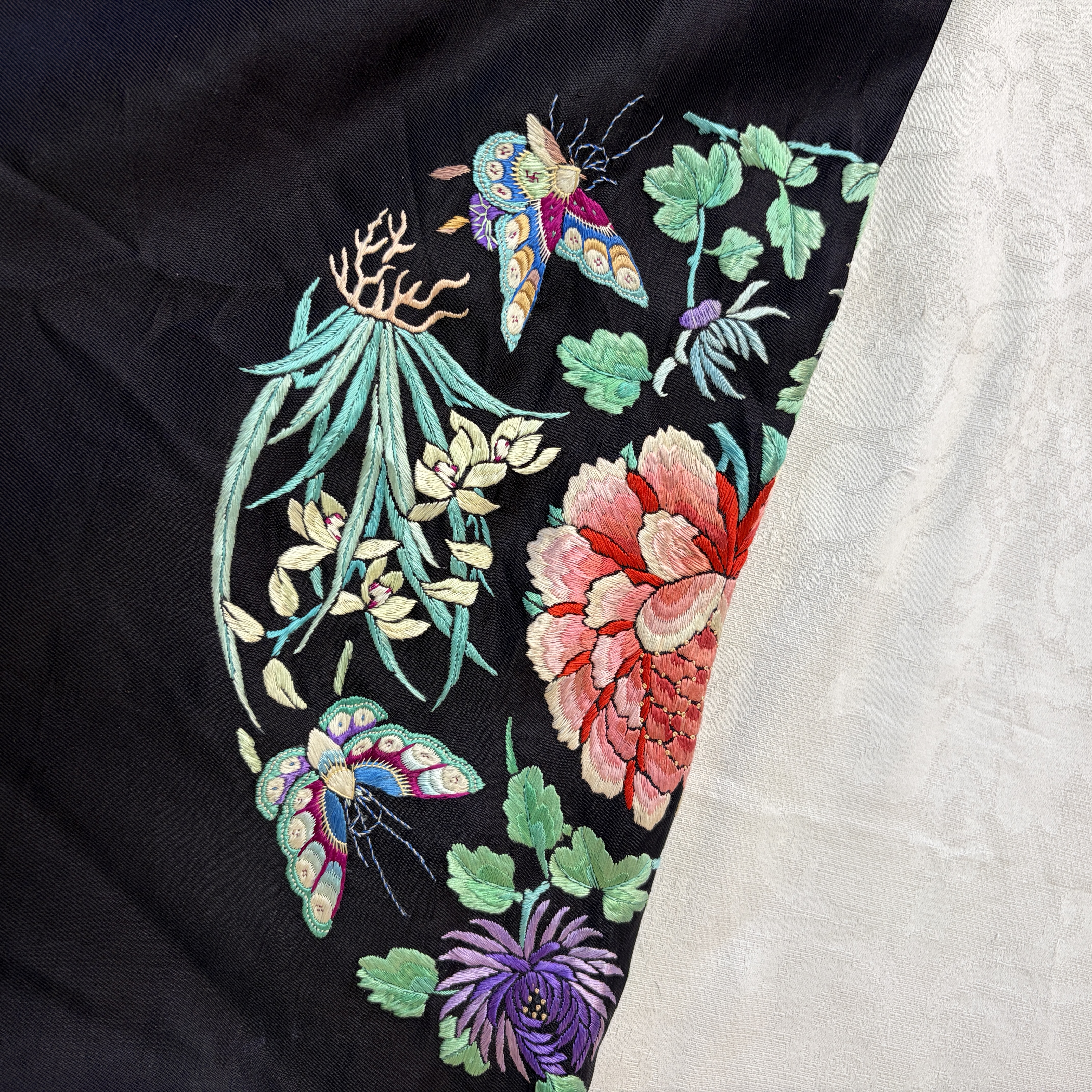 A Chinese embroidered silk dark-blue-ground robe with floral medallions — photo 14