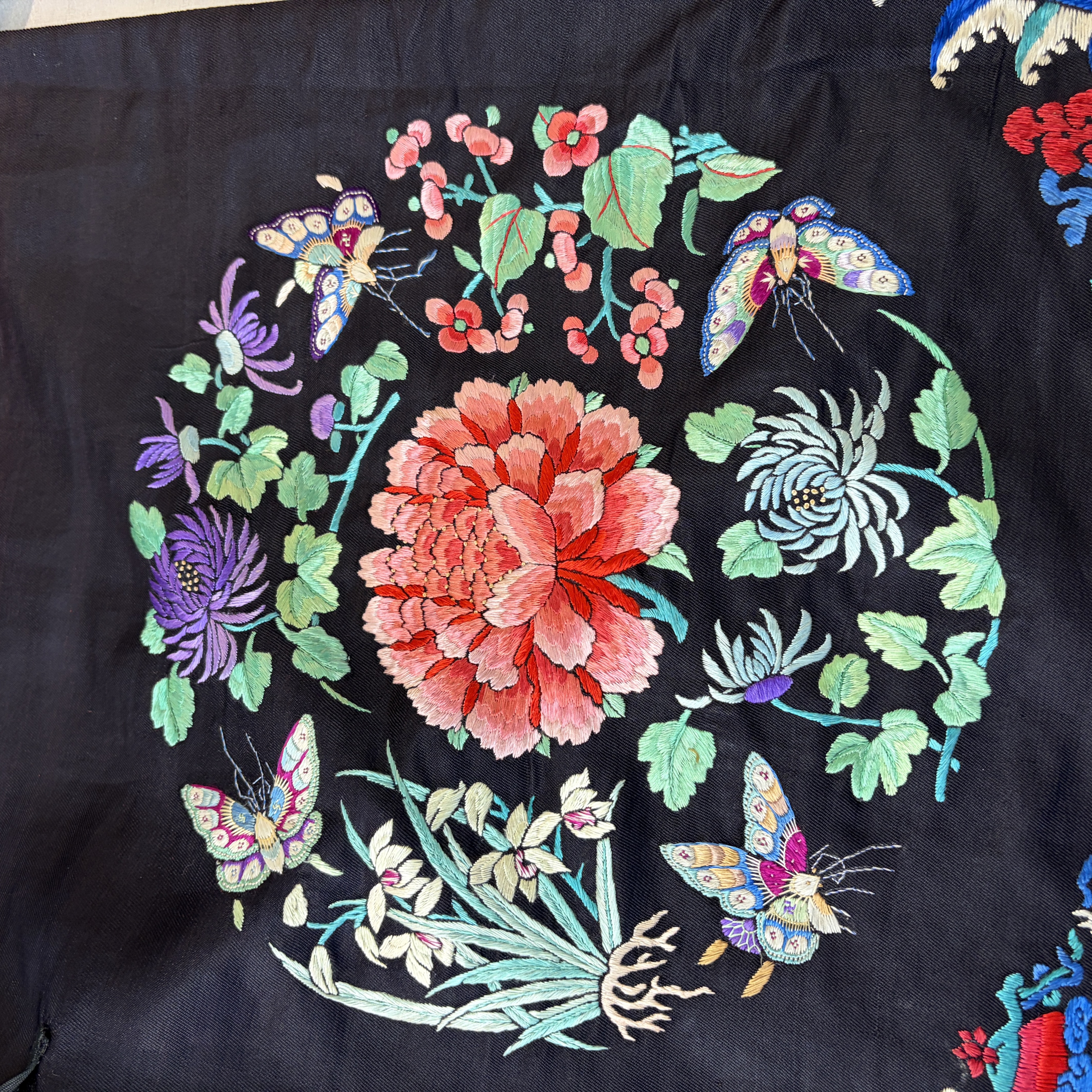 A Chinese embroidered silk dark-blue-ground robe with floral medallions — photo 26
