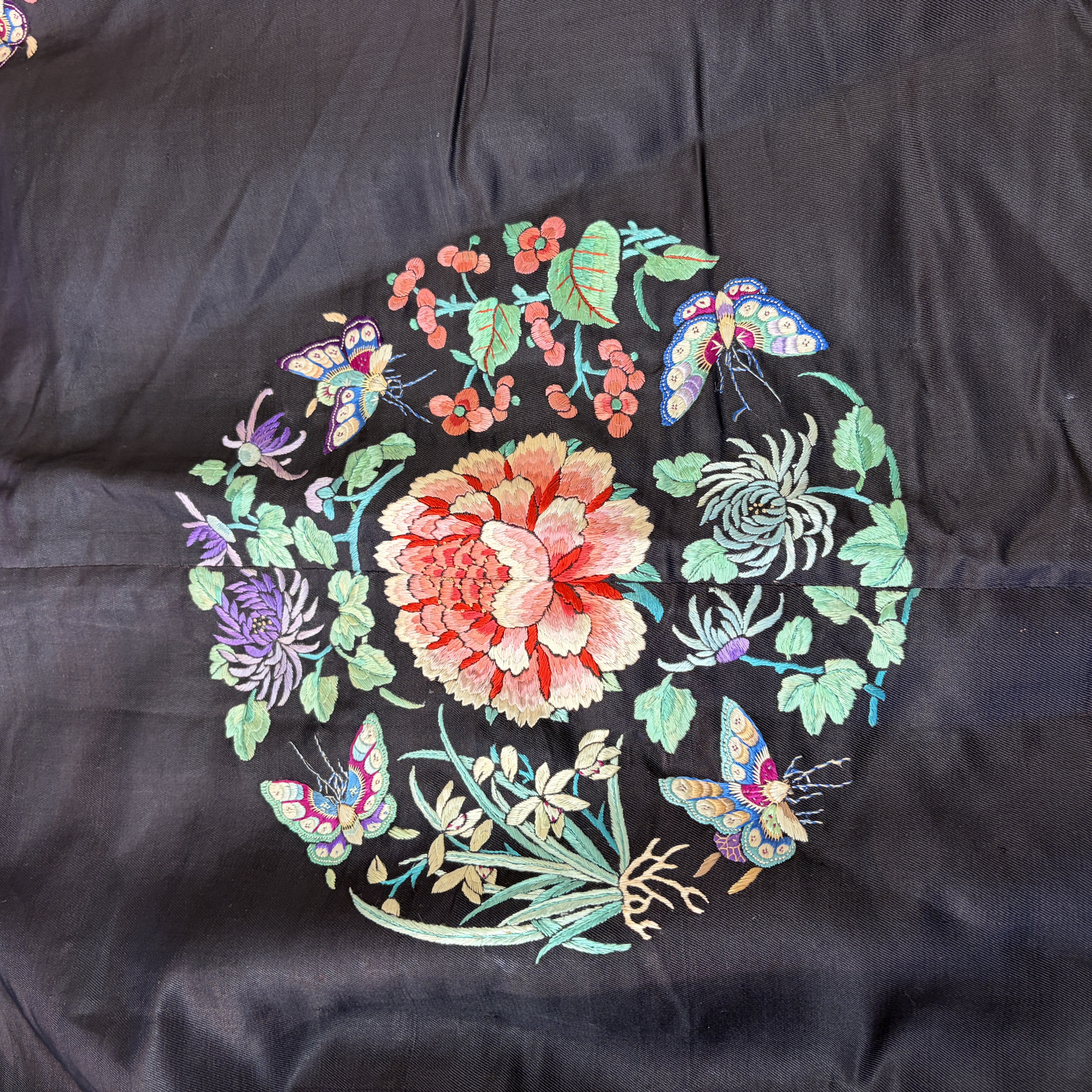 A Chinese embroidered silk dark-blue-ground robe with floral medallions — photo 31