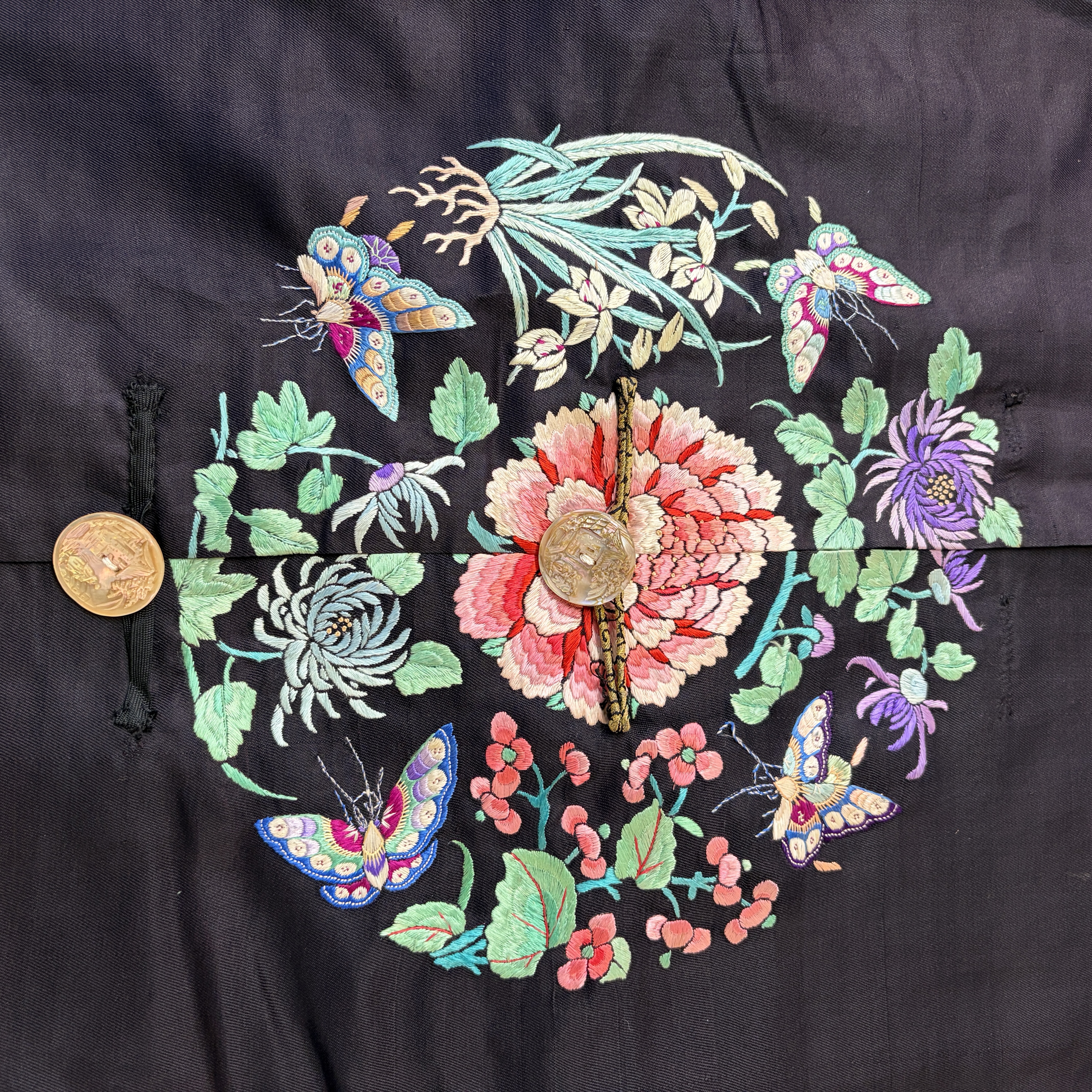 A Chinese embroidered silk dark-blue-ground robe with floral medallions — photo 2