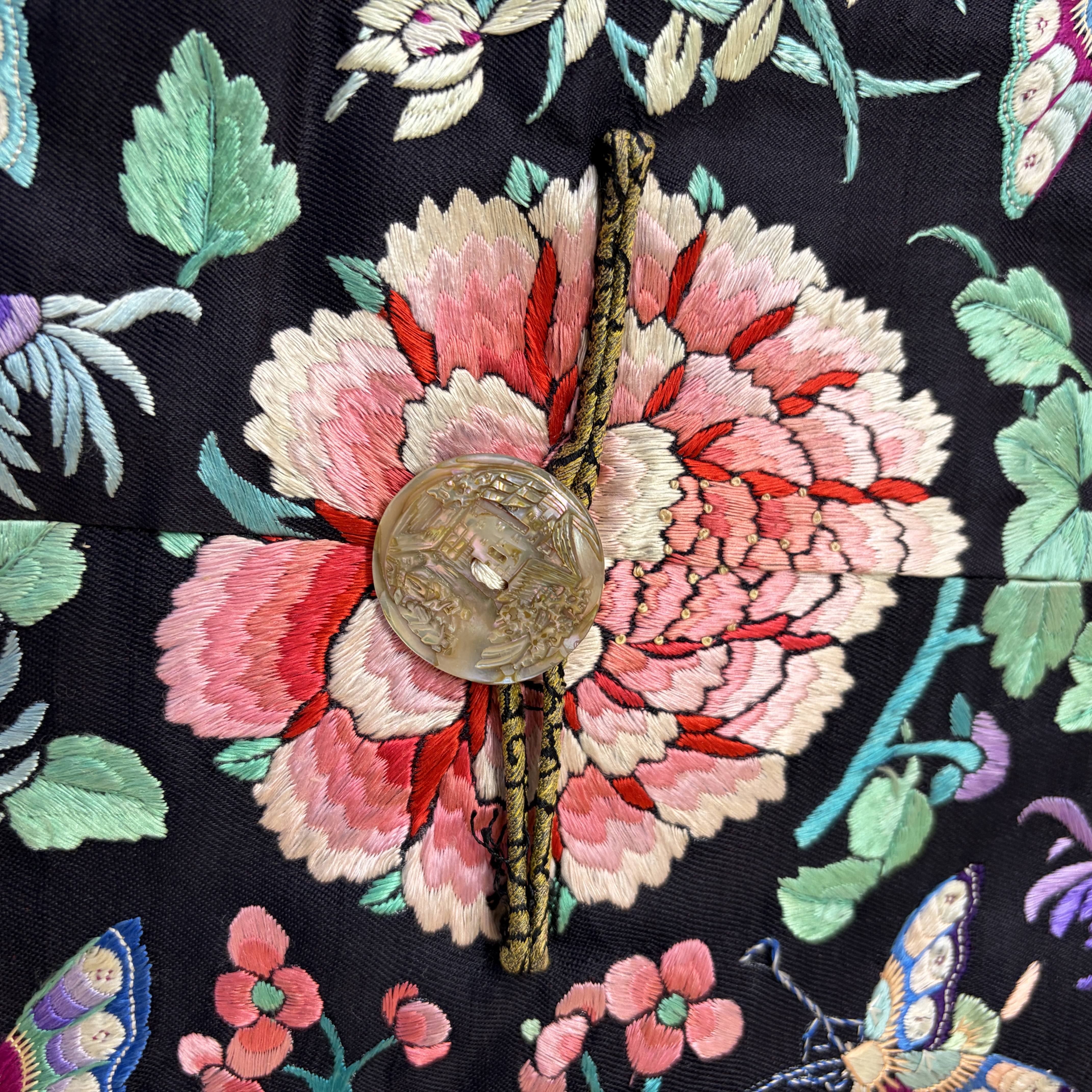 A Chinese embroidered silk dark-blue-ground robe with floral medallions — photo 3