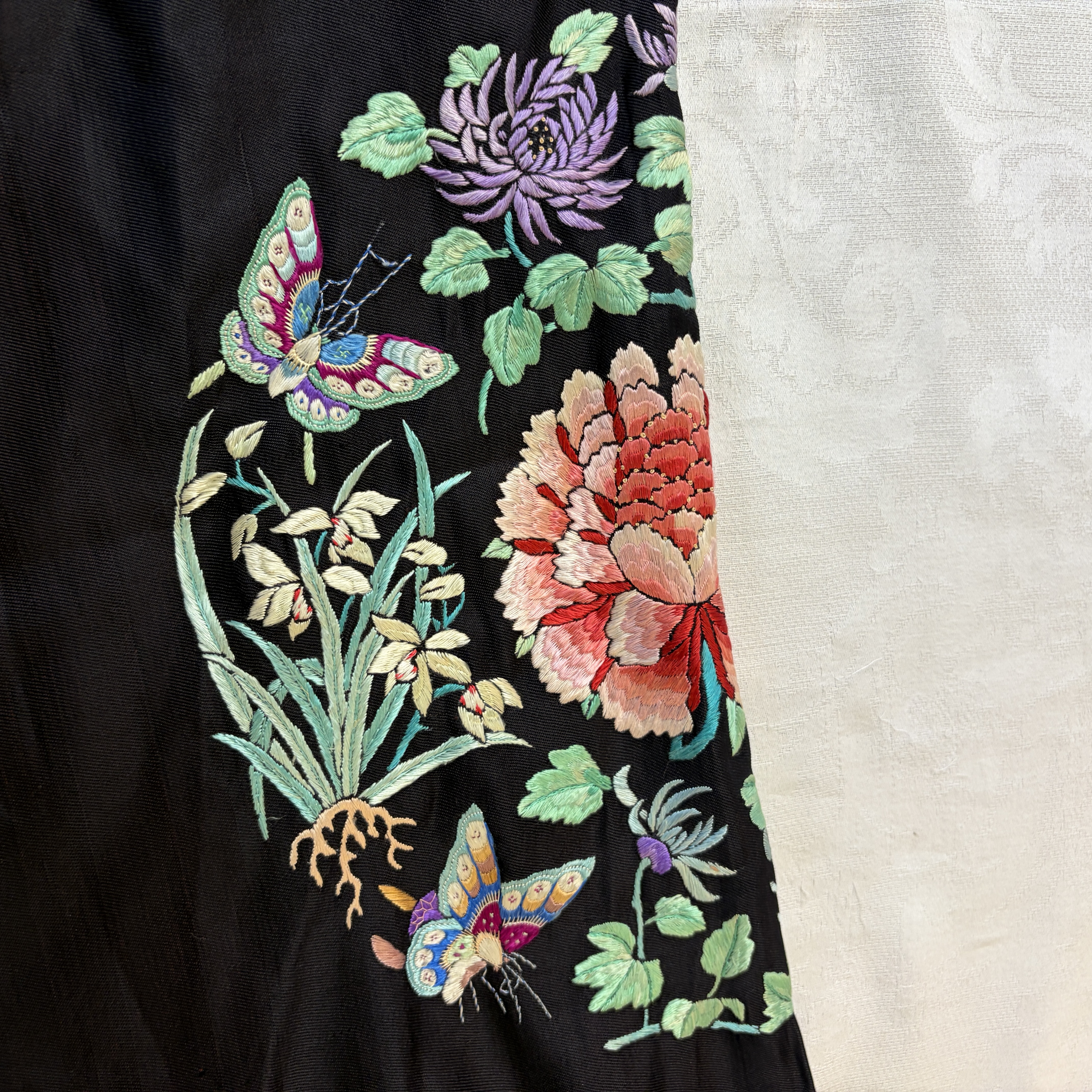 A Chinese embroidered silk dark-blue-ground robe with floral medallions — photo 5