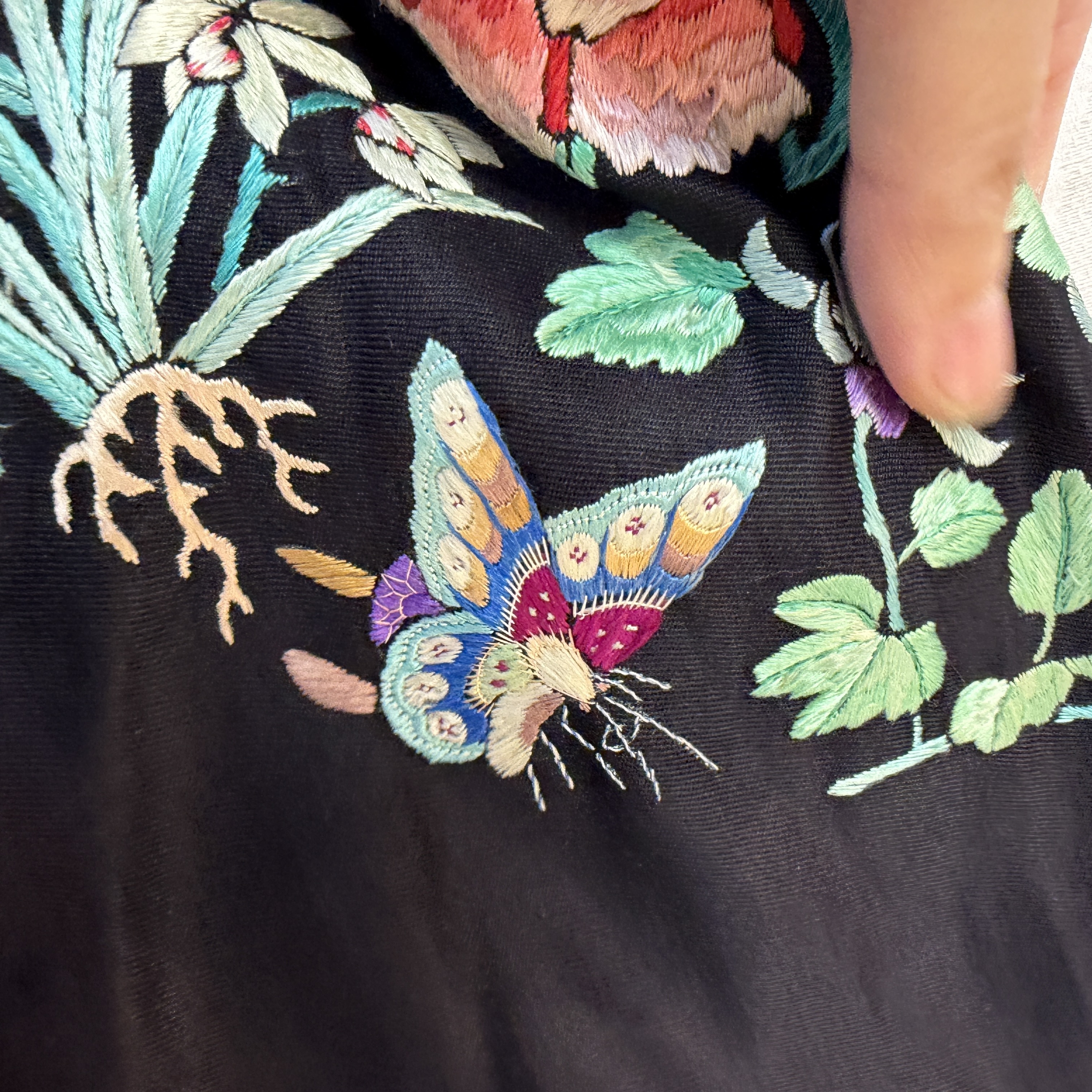 A Chinese embroidered silk dark-blue-ground robe with floral medallions — photo 7