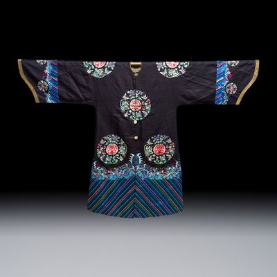 A Chinese embroidered silk dark-blue-ground robe with floral medallions, late Qing