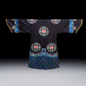 A Chinese embroidered silk dark-blue-ground robe with floral medallions — photo 2