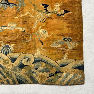 A Chinese embroidered silk 'Dragon and Phoenixes' panel — photo 2