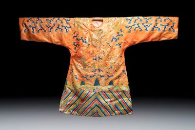 A Chinese embroidered silk salmon-ground 'dragon' robe, 19th C.