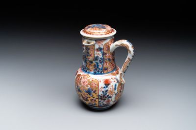 A Chinese English-decorated blue and white jug and cover, Kangxi