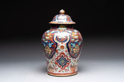 A Chinese English-decorated blue and white vase and cover, Kangxi