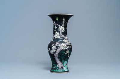 A Chinese famille noire 'magpie and prunus' yenyen vase, Kangxi