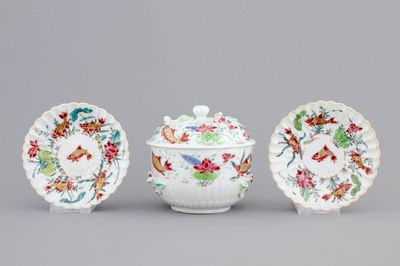 A Chinese famille rose and relief box and cover and two saucers with fish, Yongzheng, 1722-1735