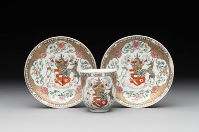 A Chinese famille rose armorial cuA fine Chinese famille rose armorial cup and two saucers, Yongzheng/Qianlongp and two saucers, Yongzheng/Qianlong