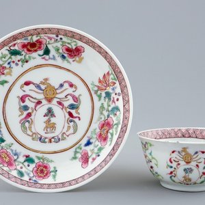 A Chinese famille rose armorial cup and saucer for the Dutch market, Yongzheng/Qianlong — photo 1