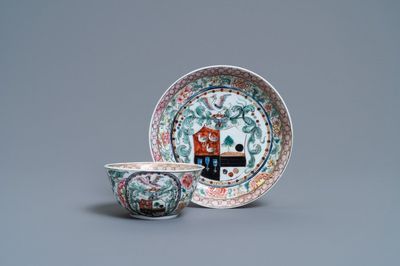 A Chinese famille rose armorial cup and saucer, Yongzheng
