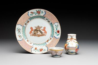 A Chinese famille rose armorial plate, a cup and a 'European subject' milk jug, Yongzheng/Qianlong