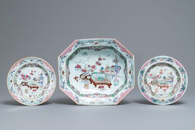 A Chinese famille rose basin and a pair of plates with 'antiquities' design, Qianlong