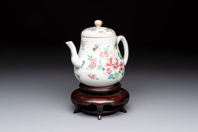 A Chinese famille rose 'Birds and Insects among Flowers' teapot on a later wooden stand, Yongzheng