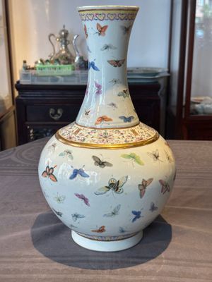 A Chinese famille rose 'butterfly' bottle vase, Guangxu mark and of the period — photo 1