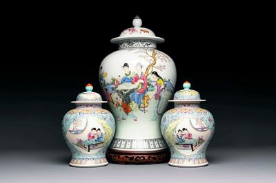 A Chinese famille rose covered vase and a pair of small covered vases, Qianlong mark, 20th C.