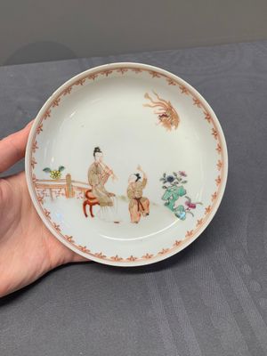 A Chinese famille rose cup and saucer with a lady playing flute, a boy and a phoenix, Qianlong — photo 2