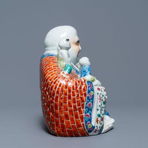 A Chinese famille rose figure of Buddha and a famille rose boy on qilin, 19th C. — photo 3