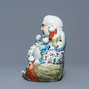 A Chinese famille rose figure of Buddha and a famille rose boy on qilin, 19th C. — photo 5