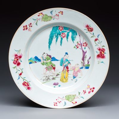 A Chinese famille rose 'Fisherman, Lady and Child' plate, Yongzheng/Qianlong
