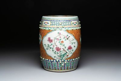 A Chinese famille rose garden seat with birds among flowering branches, 19th C.