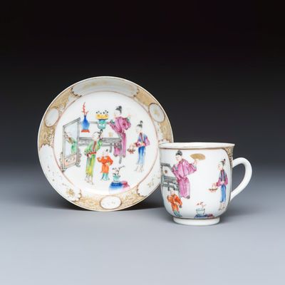 A Chinese famille rose gilt-decorated cup and saucer with figural design, Qianlong
