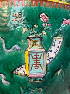 A Chinese famille rose green-ground 'Antiquities' fish bowl or jardinière with applied relief design, 19th C. — photo 9