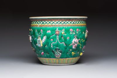 A Chinese famille rose green-ground 'Antiquities' fish bowl or jardinière with applied relief design, 19th C.