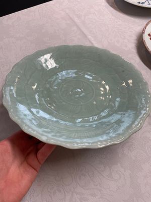 A Chinese famille rose Guanyin and a celadon-glazed dish, Chenghua mark, Qianlong/Jiaqing — photo 1