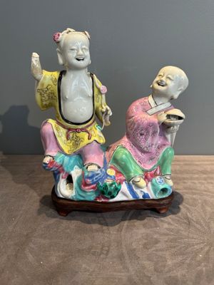 A Chinese famille rose 'Hehe Erxian' group on a wooden stand, Qianlong — photo 1