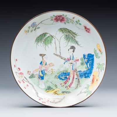A Chinese famille rose 'Ladies in a Garden' plate, Yongzheng
