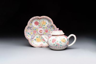 A Chinese famille rose moulded teapot and stand with floral design, Yongzheng/Qianlong