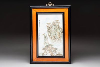 A Chinese famille rose ‘mountainous landscape’ plaque in wooden frame, signed Wang Xiliang 王锡良, dated 1931