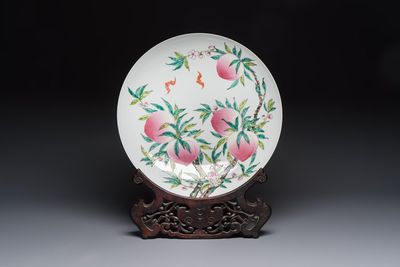 A Chinese famille rose 'Nine Peaches' dish on wooden stand, Yongzheng mark, 20th C.