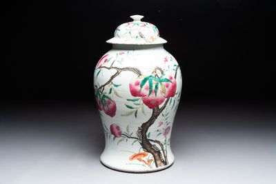 A Chinese famille rose 'nine peaches' vase and cover, 19th C.