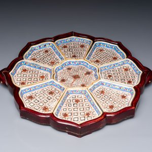 A Chinese famille rose nine-piece 'Plum Blossoms' sweetmeat set on a wooden tray, 19th C. — photo 1